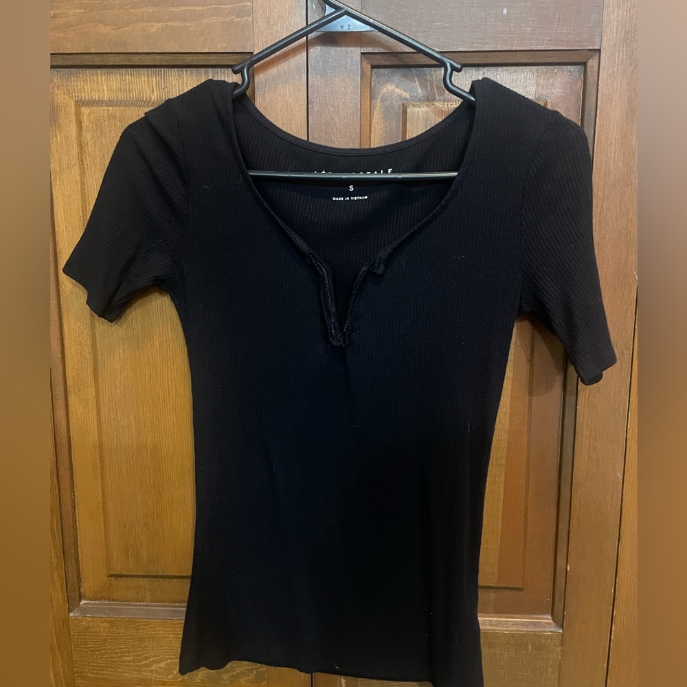Black fitted v-neck top from Aeropostale. Small. Slightly worn and polyester.